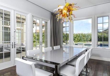 formal-dining-room-looks-fancy-floor--ceiling-windows