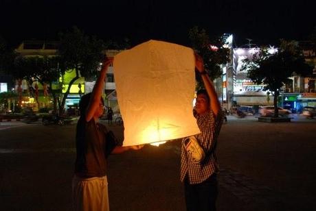 Launching a latern at night in Chiang Mai, Thailand