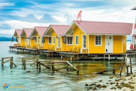 Isla Carenero Panama hotel with brilliant yellow and red cabanas