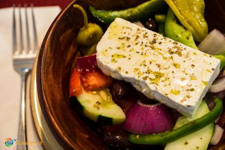 individual authentic greek salad with fork and napkin