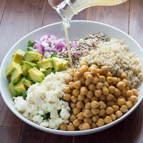 Kale, Barley and Feta Salad with a Honey-Lemon Vinaigrette | Kale, Barley, Feta, Chickpeas, Avocado, Sunflower Seeds and Red Onion are tossed in a tangy Honey-Lemon Vinaigrette. #lunch #kale